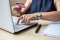 Businesswoman holding credit card for online shopping while making orders via the Internet. business, technology, ecommerce and Royalty Free Stock Photo