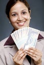 Businesswoman holding currency Royalty Free Stock Photo