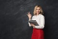 Businesswoman holding documents and showing ok sign Royalty Free Stock Photo