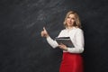 Businesswoman holding documents and showing ok sign Royalty Free Stock Photo