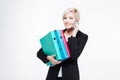 Businesswoman holding folders and talking on the phone Royalty Free Stock Photo