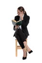 Businesswoman holding her book and making a mad sign Royalty Free Stock Photo