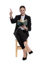 Businesswoman holding her book while making ok sign Royalty Free Stock Photo