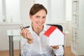 Businesswoman Holding Key And House Model Royalty Free Stock Photo