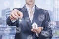 A businesswoman holding a key and a house model Royalty Free Stock Photo