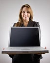 Businesswoman holding laptop