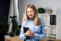Businesswoman Holding Large File. young womanl standing in the office and holding folder. Portrait of young office worker holding Royalty Free Stock Photo