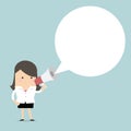 Businesswoman holding megaphone with speech bubble for text Royalty Free Stock Photo