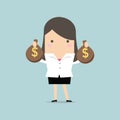 Businesswoman holding a money bag with dollar sign Royalty Free Stock Photo