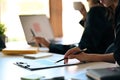 Businesswoman holding checking financial reports at office desk. Royalty Free Stock Photo