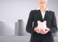 Businesswoman holding piggy bank Royalty Free Stock Photo