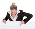 Businesswoman holding placard