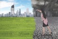 Businesswoman transforming polluted city into green city concept