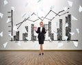 Businesswoman holding sandglass and alarm clock Royalty Free Stock Photo