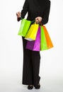 Businesswoman holding several paper bags