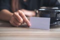 A businesswoman holding and showing an empty business card in f Royalty Free Stock Photo