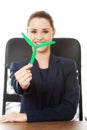 Businesswoman holding small windmill Royalty Free Stock Photo