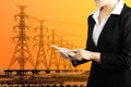 Businesswoman holding smart phone for industry energy business c
