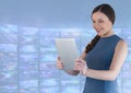 Businesswoman holding tablet with colourful blue screen visuals Royalty Free Stock Photo