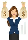 Businesswoman holding two big dollar money bags Royalty Free Stock Photo