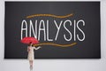 Businesswoman holding umbrella against analysis