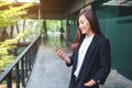 A businesswoman holding and using mobile phone in the office Royalty Free Stock Photo