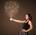 Businesswoman holding a white cup with social media icons Royalty Free Stock Photo