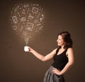 Businesswoman holding a white cup with social media icons Royalty Free Stock Photo