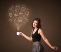 Businesswoman holding a white cup with social media icons Royalty Free Stock Photo