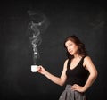 Businesswoman holding a white steamy cup