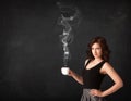 Businesswoman holding a white steamy cup