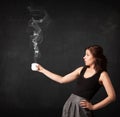 Businesswoman holding a white steamy cup