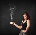 Businesswoman holding a white steamy cup