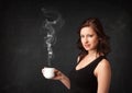 Businesswoman holding a white steamy cup