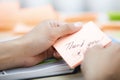 Businesswoman holdings sticky note with Thank you text