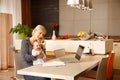 Businesswoman at home with baby Royalty Free Stock Photo
