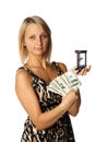Businesswoman with hourglass and money