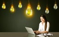 Businesswoman with idea bulbs