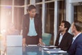 Businesswoman interacting with coworkers in a meeting in the conference room Royalty Free Stock Photo