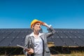 Business woman or investor inspecting her solar farm