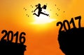 Businesswoman jump between 2016 and 2017 Royalty Free Stock Photo