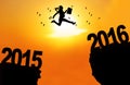 Businesswoman jump over cliff with numbers 2016 Royalty Free Stock Photo