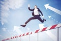 Businesswoman jumping through hurdles with arrows Royalty Free Stock Photo