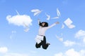 Businesswoman jumps while throwing documents Royalty Free Stock Photo