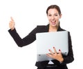 Businesswoman with laptop computer and thumb up Royalty Free Stock Photo