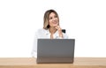 Businesswoman with laptop on desk, smiling. Isolated over white background Royalty Free Stock Photo