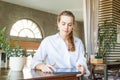 Businesswoman with laptop gadget at work