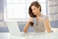 Businesswoman with laptop having tea Royalty Free Stock Photo