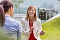 Businesswoman laughing while talking to her colleague Royalty Free Stock Photo