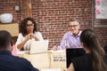 Businesswoman Leading Office Meeting Of Colleagues Sitting Around Table Royalty Free Stock Photo